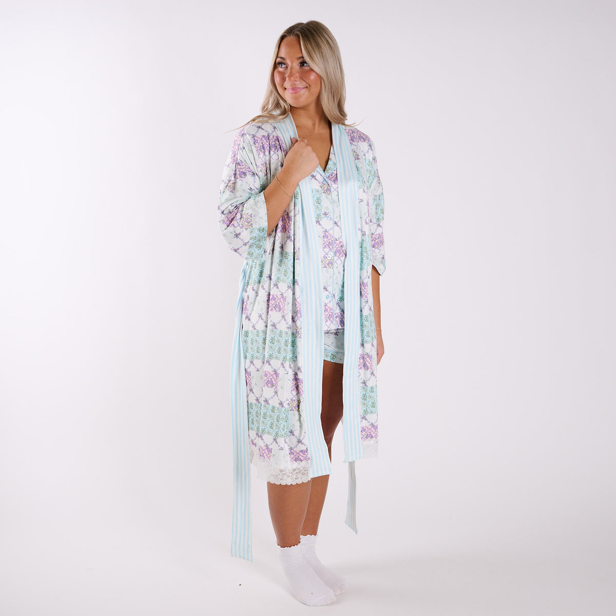 Floral patchwork robe front view worn open with striped trim and lightweight drape.