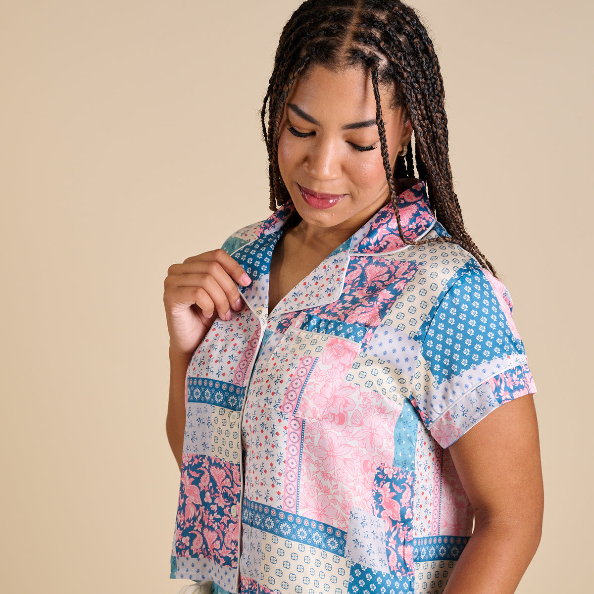 Close-up of Simply Southern patchwork pajama top featuring pastel quilt-style print and button front.