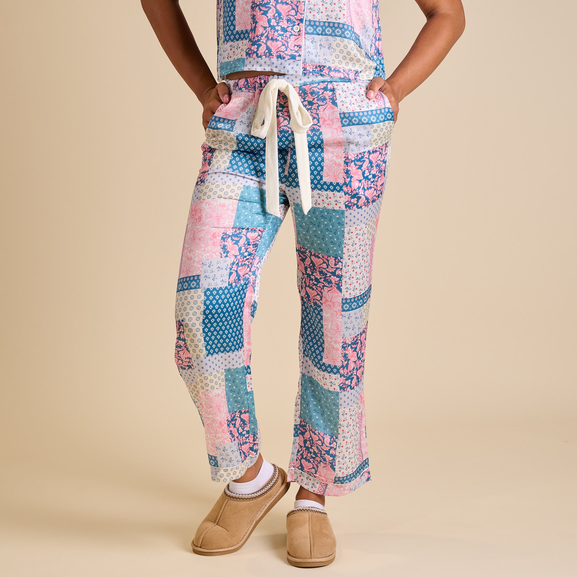 Front view of women’s Simply Southern patchwork pajama pants in pink, blue, and white with satin drawstring waist.
