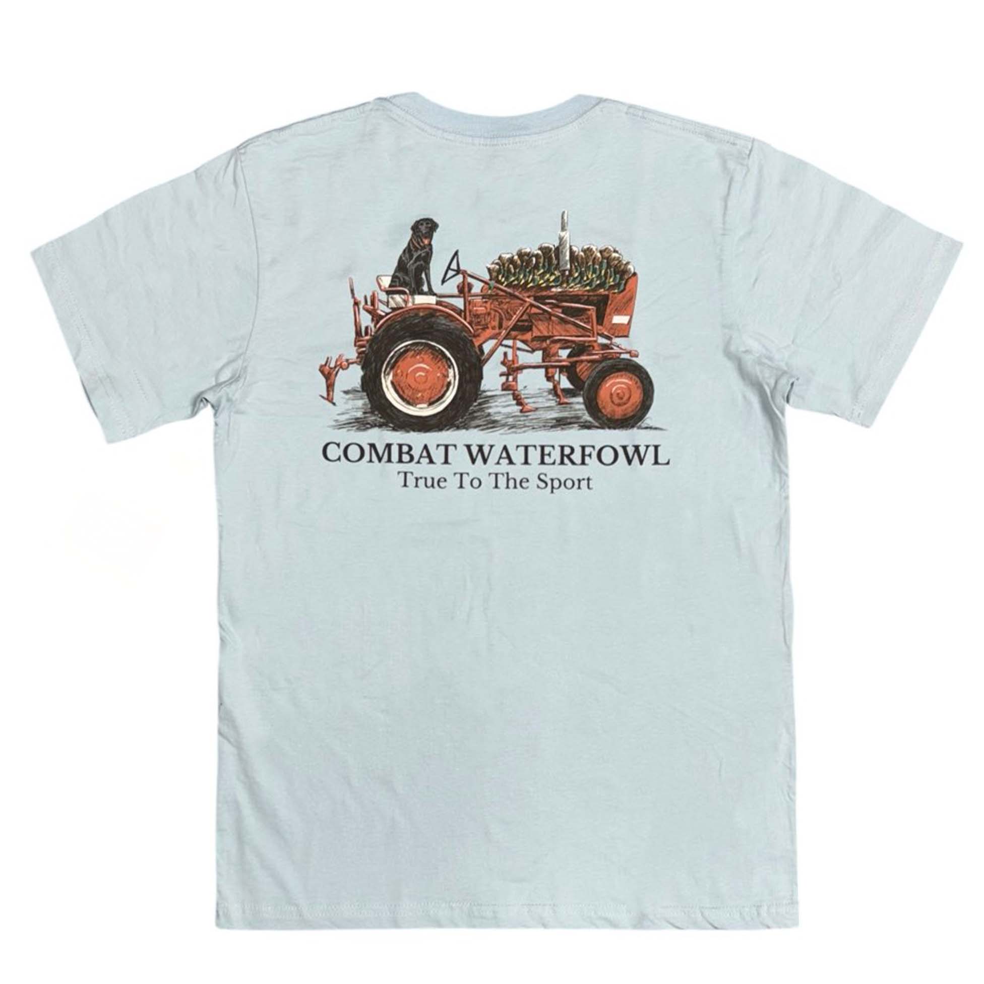Light blue Combat Waterfowl t-shirt with a black lab riding a red tractor carrying duck decoys and “True to the Sport” text below.
