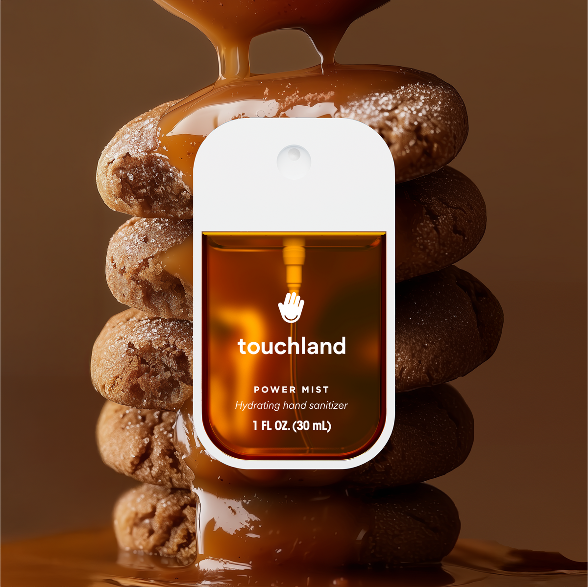 Touchland hand sanitizer bottle with pump on a brown background