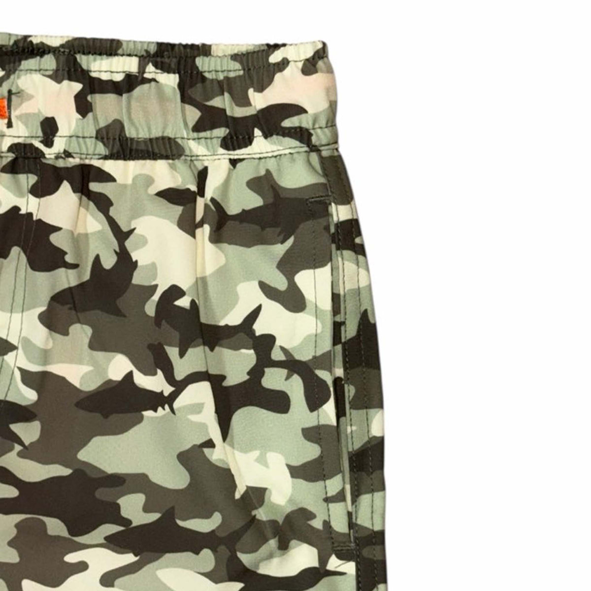 Camouflage-patterned swim shorts on a white background