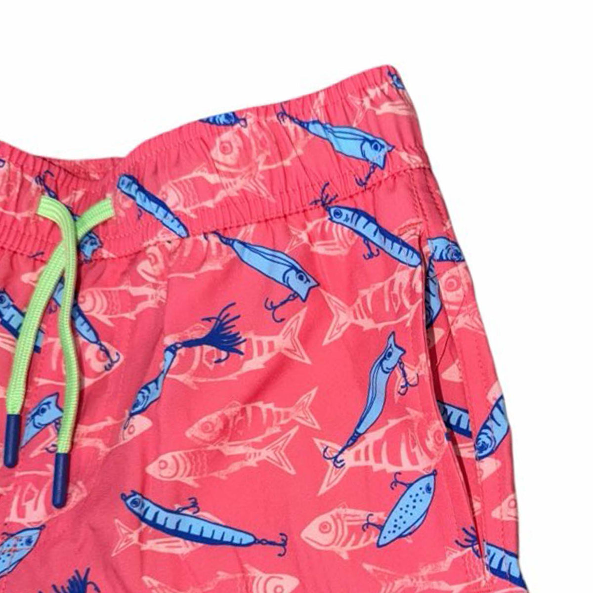 Close up of youth coral swim trunks with fish and hook pattern.
