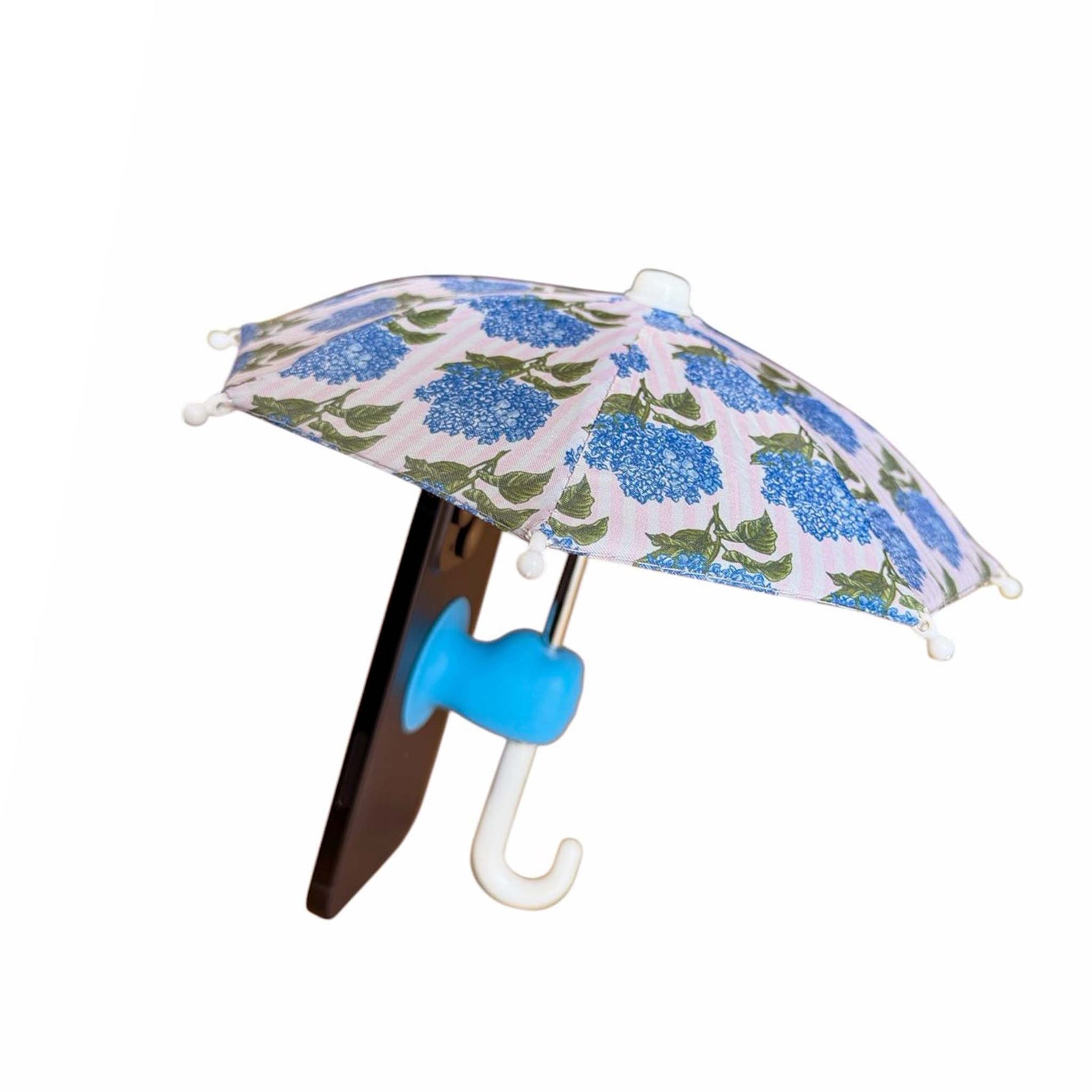 Miniature umbrella with floral pattern attached to a smart phone shown on a white background
