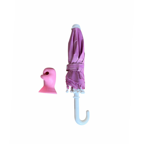 Pink umbrella with white handle and pink suction cup shown on a white background