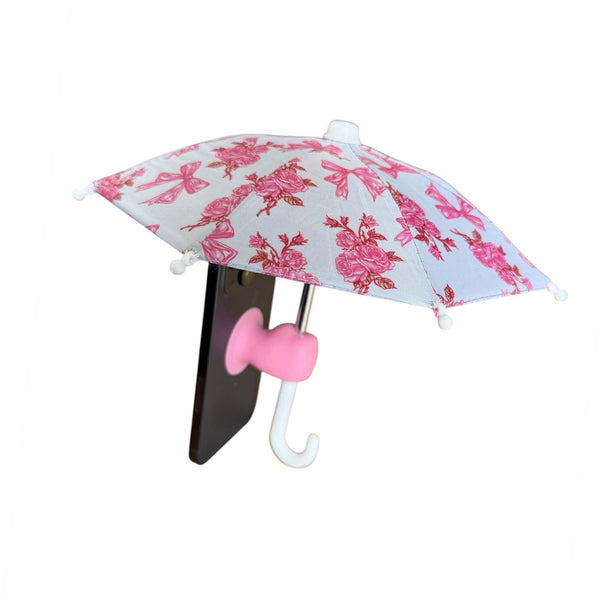 Pink mini umbrella with floral design attached to a smart phone shown on a white background