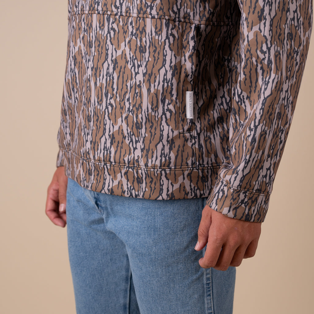 Patterned jacket with a brand label on a beige background