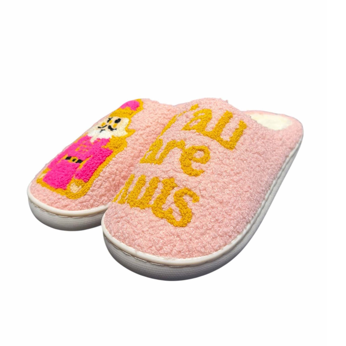 Pink slippers with cartoon character and text on a white background