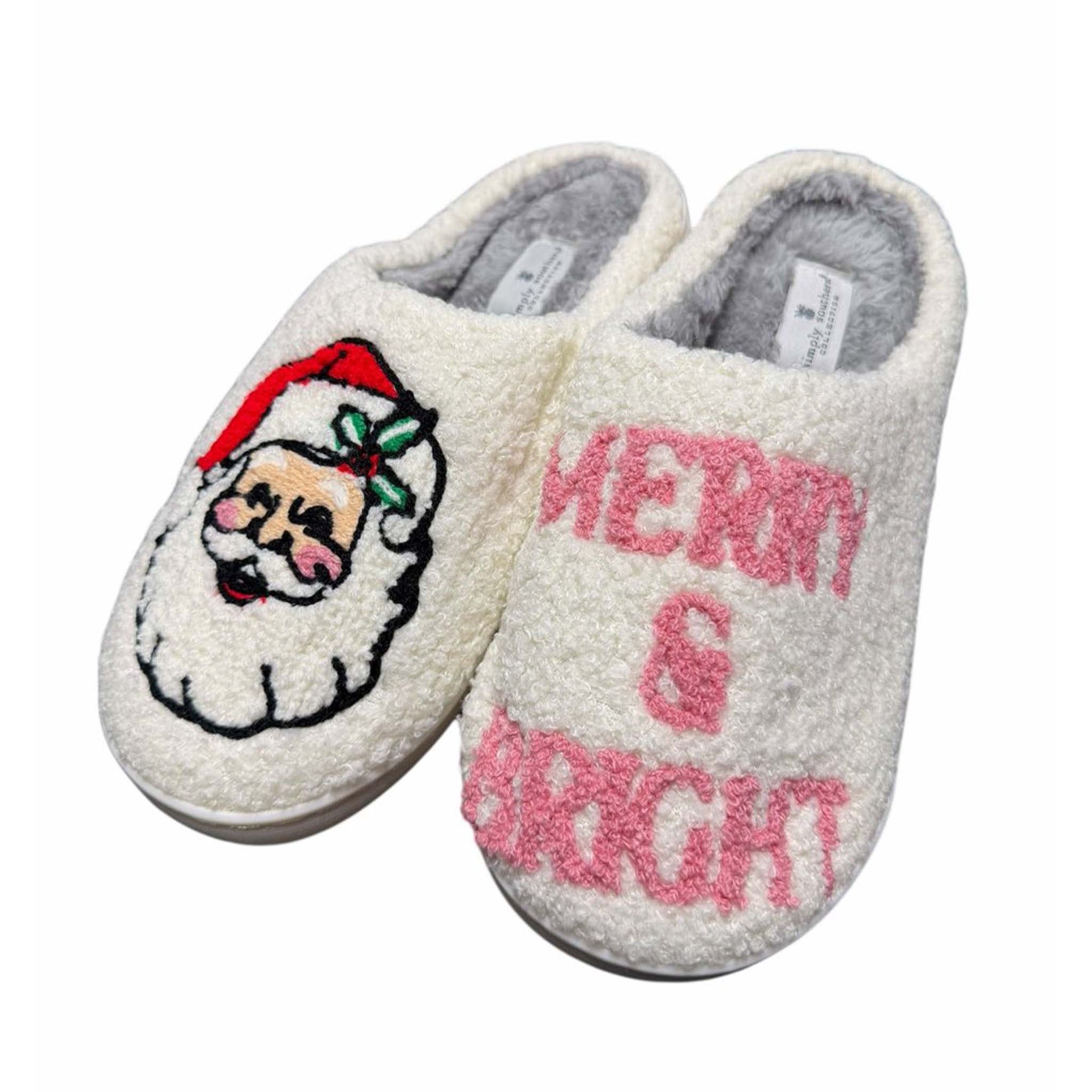 Pair of slippers with Santa Claus face and 'Merry & Bright' text on a white background