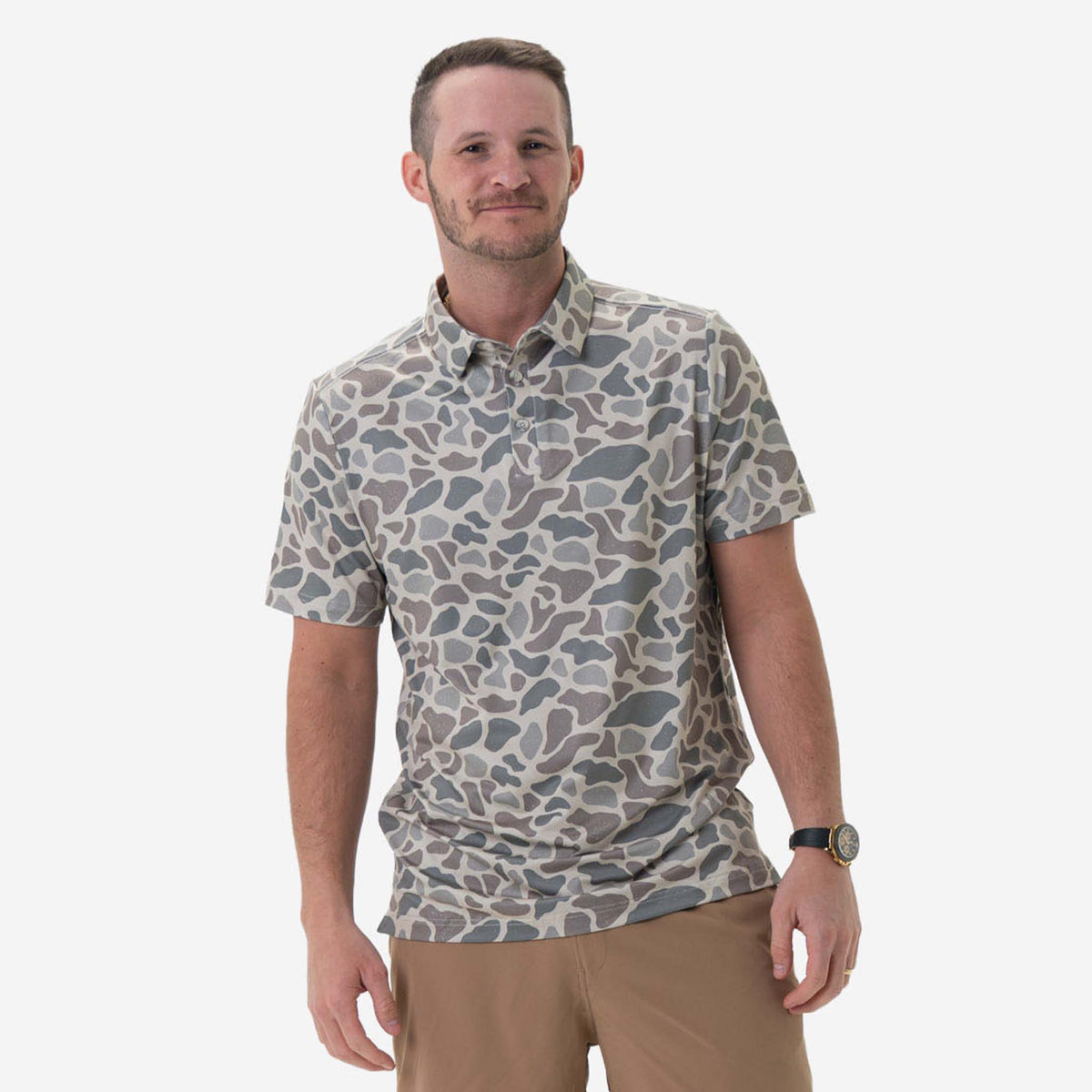 Man wearing Burlebo's Classic Deer Camo Performance Polo on a white background