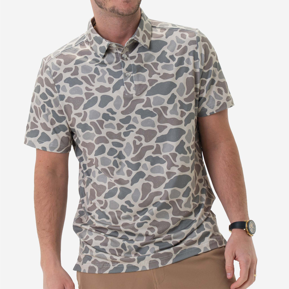 Man wearing Burlebo's Classic Deer Camo Performance Polo on a white background