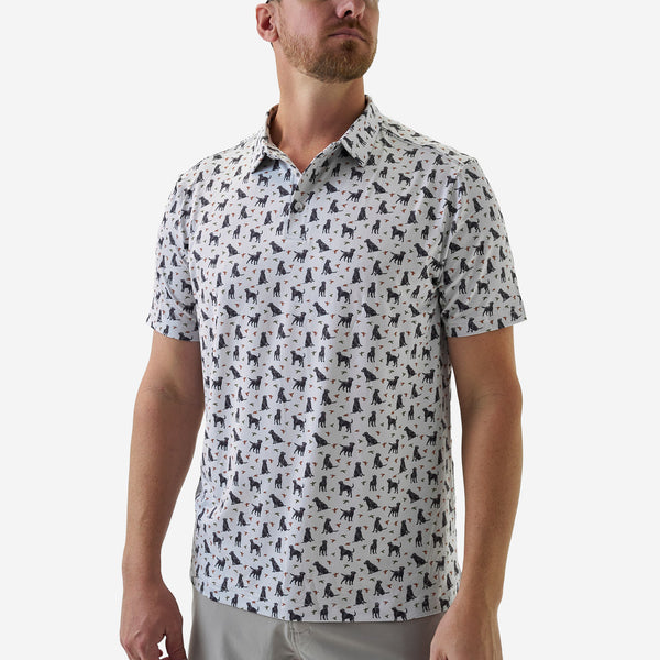 Man wearing a patterned short-sleeve shirt on a white background