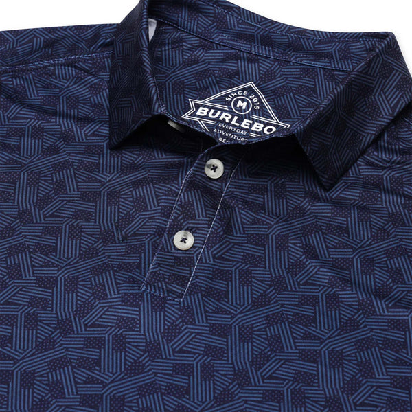 Burlebo Stars and Stripes Short Sleeve Performance Polo, sizes S-XXL, Close-up of the collar and buttons on the Burlebo Stars and Stripes Performance Polo, highlighting the detailed navy-on-navy print and inner branding.