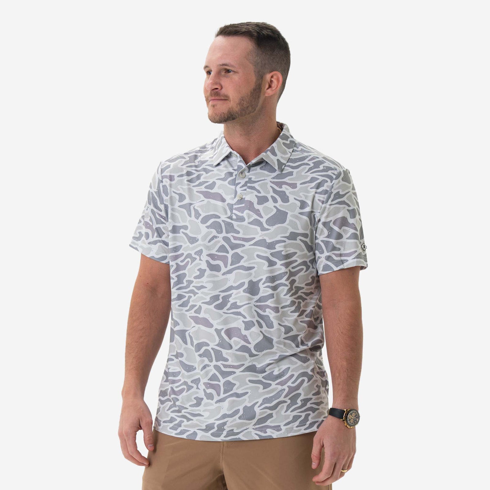 Man wearing Burlebo's White Camo Performance Polo in front of a white backdrop