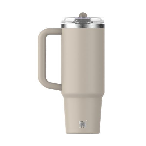 Back of beige stanley tumbler with handle.