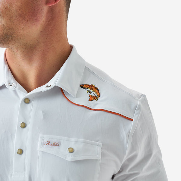 White shirt with a fish design on the collar and 'Charlize' branding on the pocket.