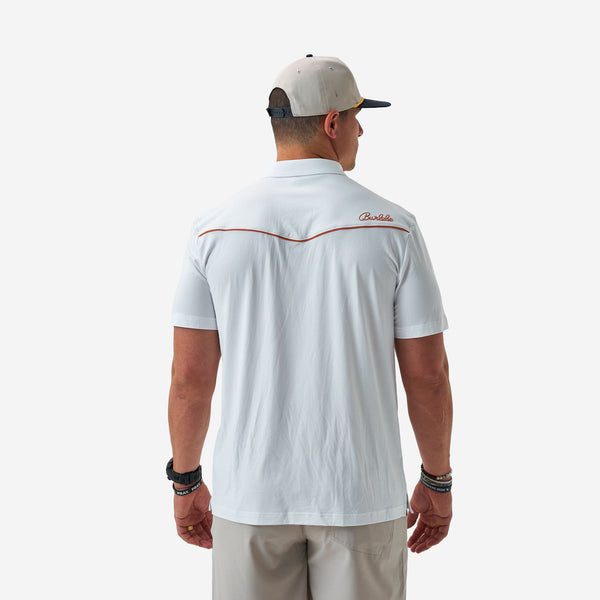 Man wearing a white polo shirt with red accents and a logo on the back, standing against a white background.