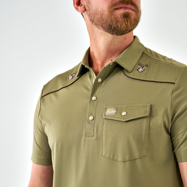 Man wearing a green shirt with a pocket and buttons on a white background