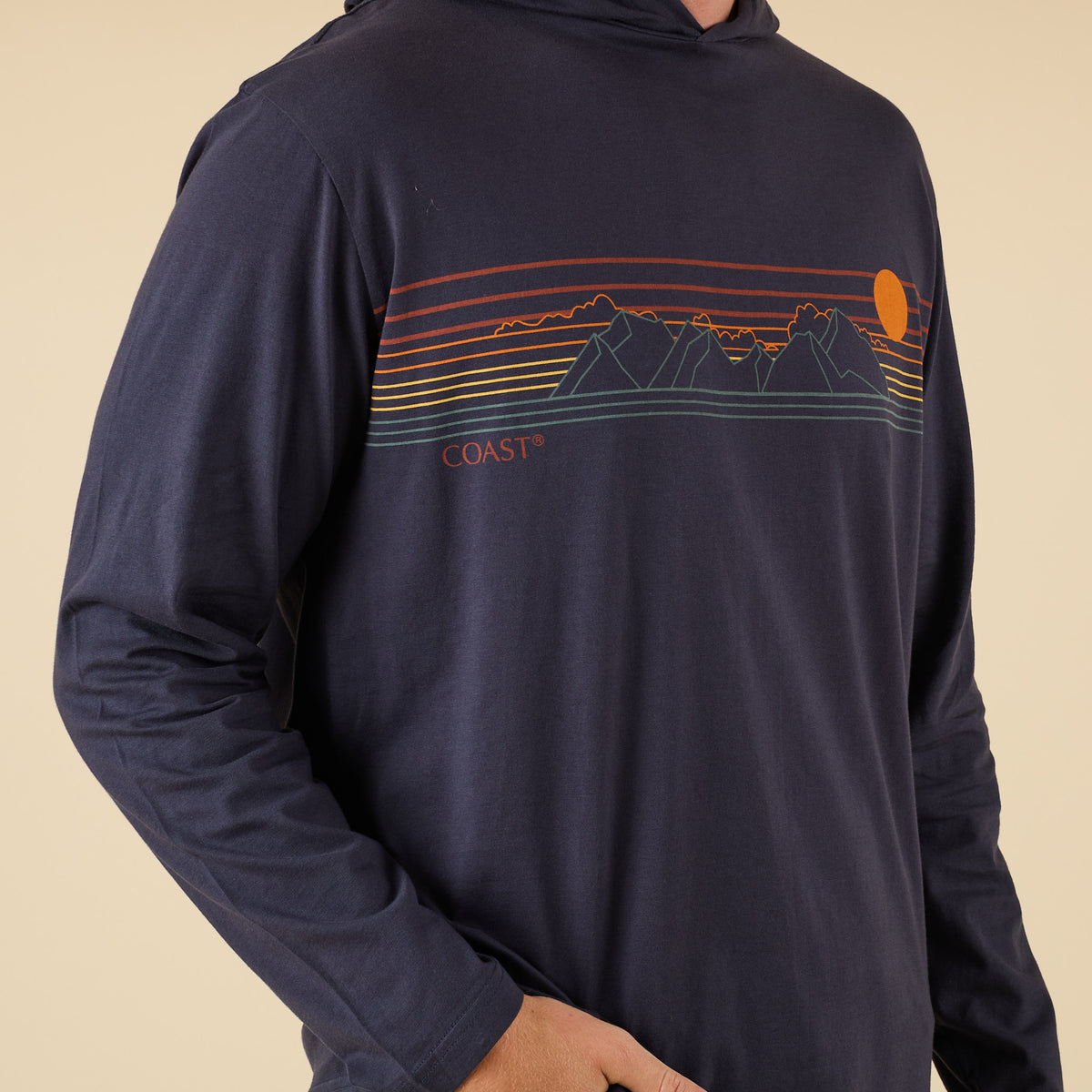 COAST Mountains Hoodie Tee in navy with retro mountain and sunset chest graphic, shown front view.
