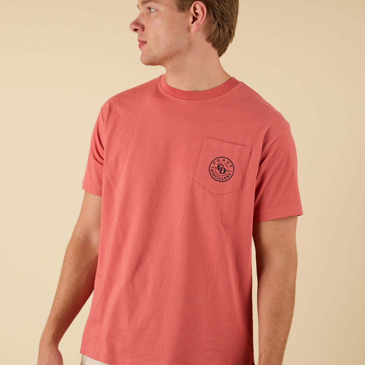 COAST Distillery short sleeve t-shirt in red with front pocket featuring small circular logo.
