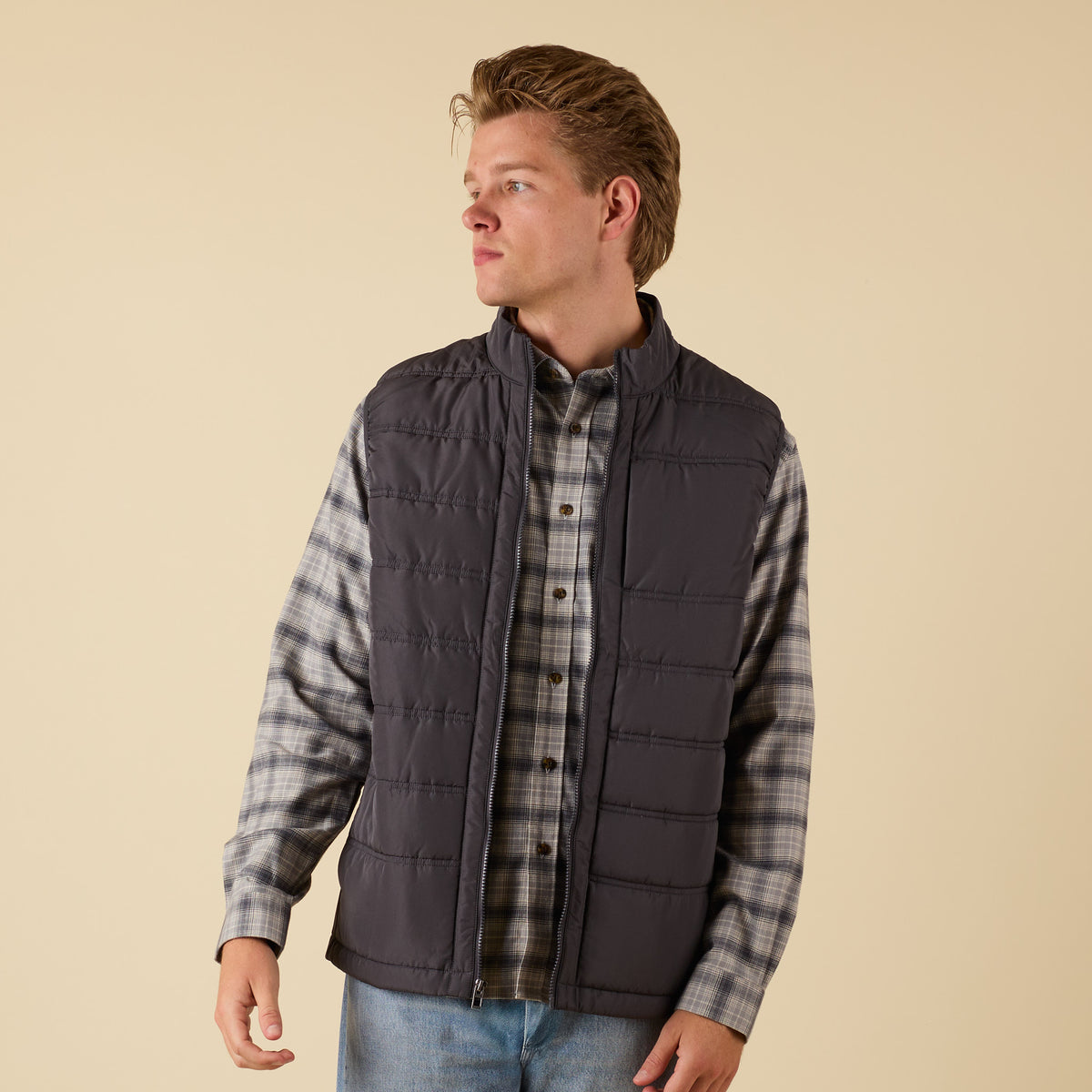 5. Front view of Coast Apparel Foredeck Vest in Washed Black worn over plaid shirt
