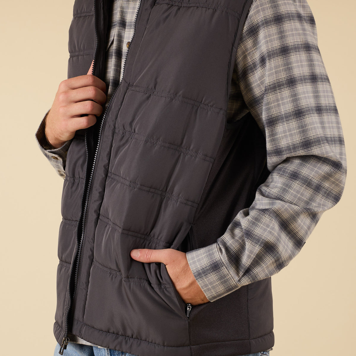 6. Close-up of Coast Apparel Foredeck Vest in Washed Black with hand in pocket
