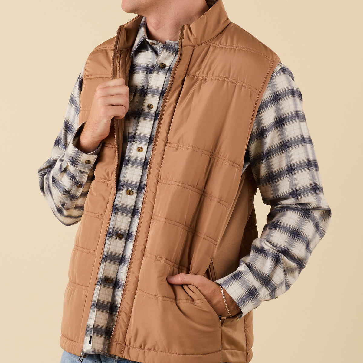 Close-up of Coast Apparel Foredeck Vest in Chestnut showing zipper and pocket detail