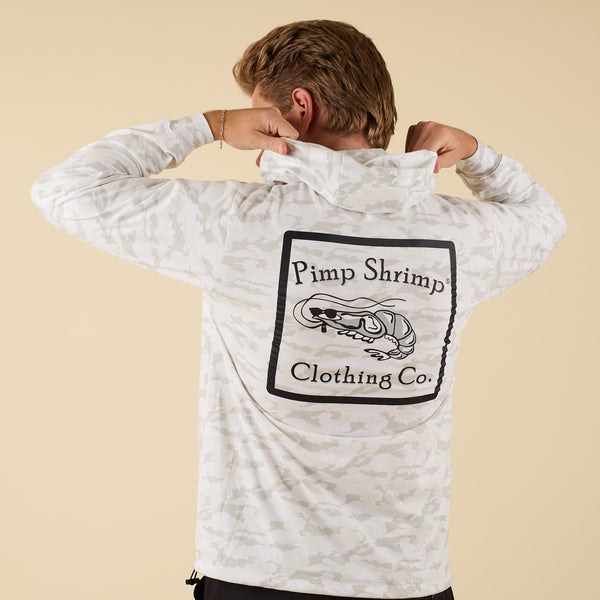 Man wearing a white camo t-shirt hoodie with the Pimp Shrimp logo on the back.