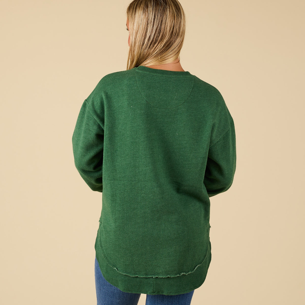 Back view of plain green holiday sweatshirt with ribbed hem and cuffs.