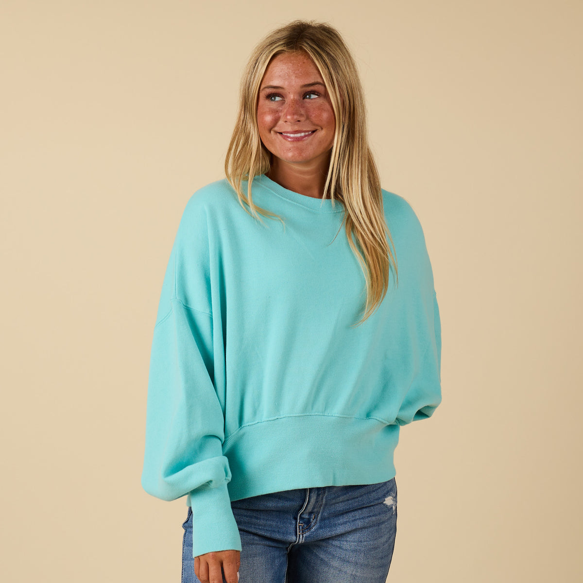 Beach mint Youngstown crewneck sweatshirt with long sleeves and ribbed trim, modeled from the front