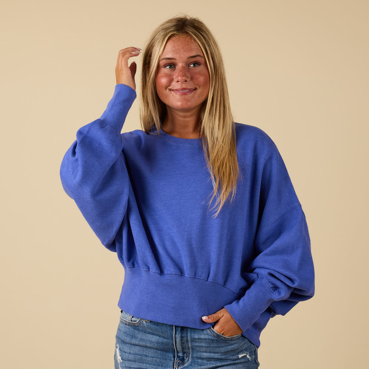 Periwinkle Youngstown crewneck sweatshirt with relaxed fit and ribbed hem, modeled from the front.