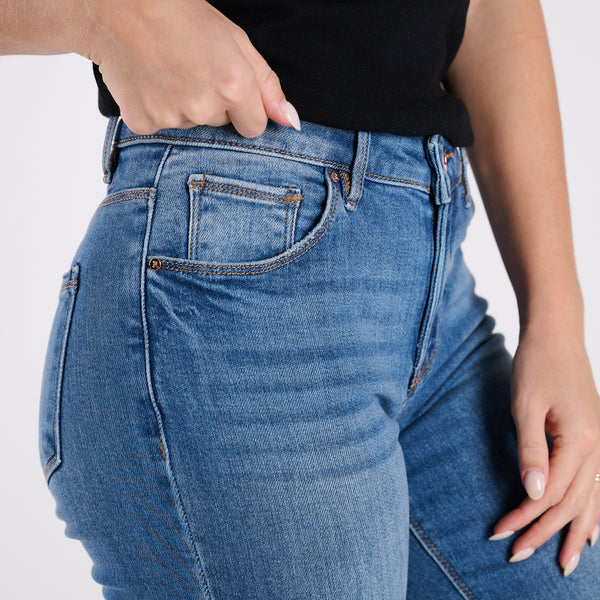 Mid Rise Raw Cut Medium Wash Jeans