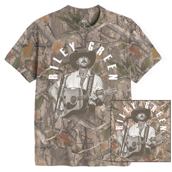 Camouflage t-shirt with a graphic of a person playing guitar and 'Riley Green' text.