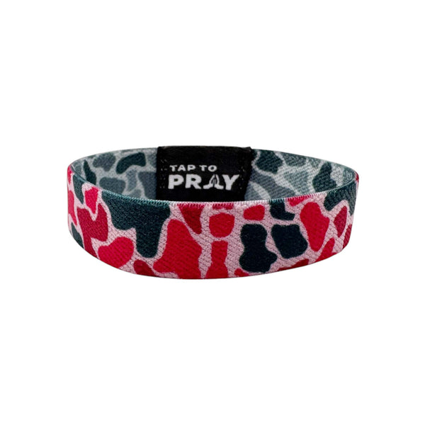 Colorful camouflage-patterned wristband with 'Tap to Pray' text on a white background