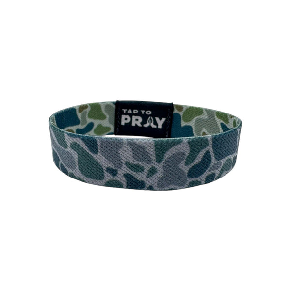 Camouflage-patterned wristband with 'Tap to Pray' text on a white background