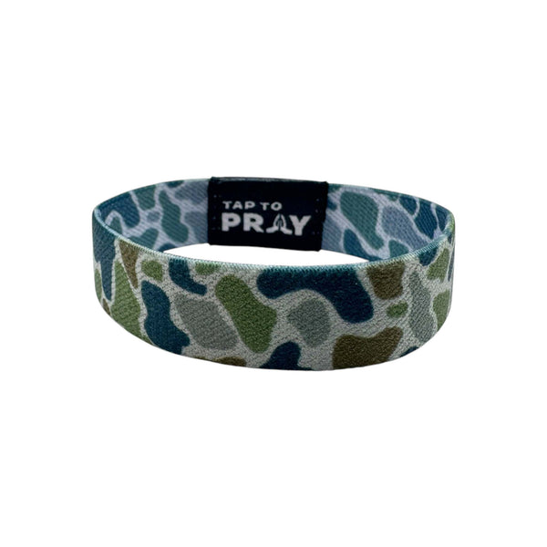 Camouflage-patterned wristband with 'Tap to Pray' text on a white background