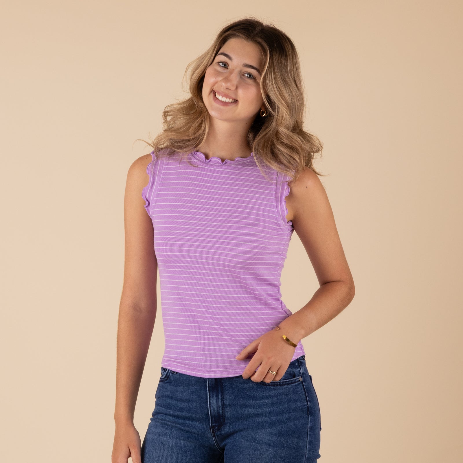 Zenana Ruffled Stripe Tank, color lavender with white stripes, sizes S-L
Zenana ruffle stripe tank featuring vertical stripes, ruffled straps and neckline, and a relaxed, lightweight fit.