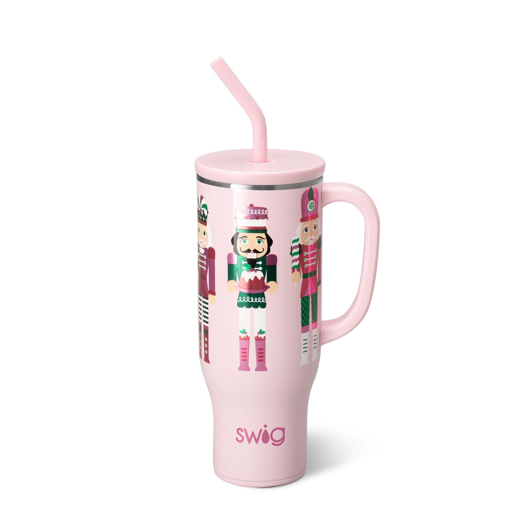 Pink tumbler with nutcracker design and straw on a white background