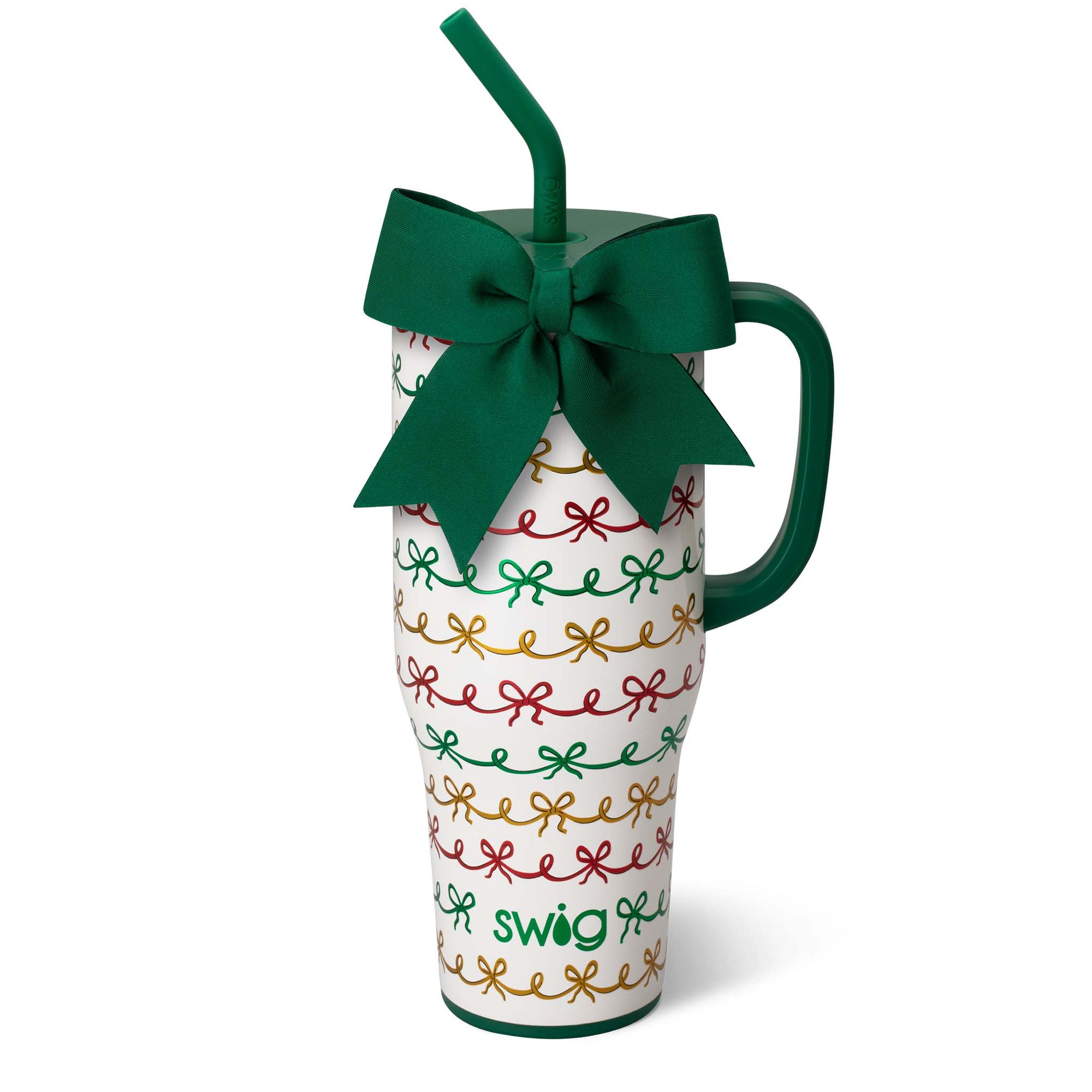 White mug with colorful bow pattern, green handle, and straw, tied with a green bow on a white background.