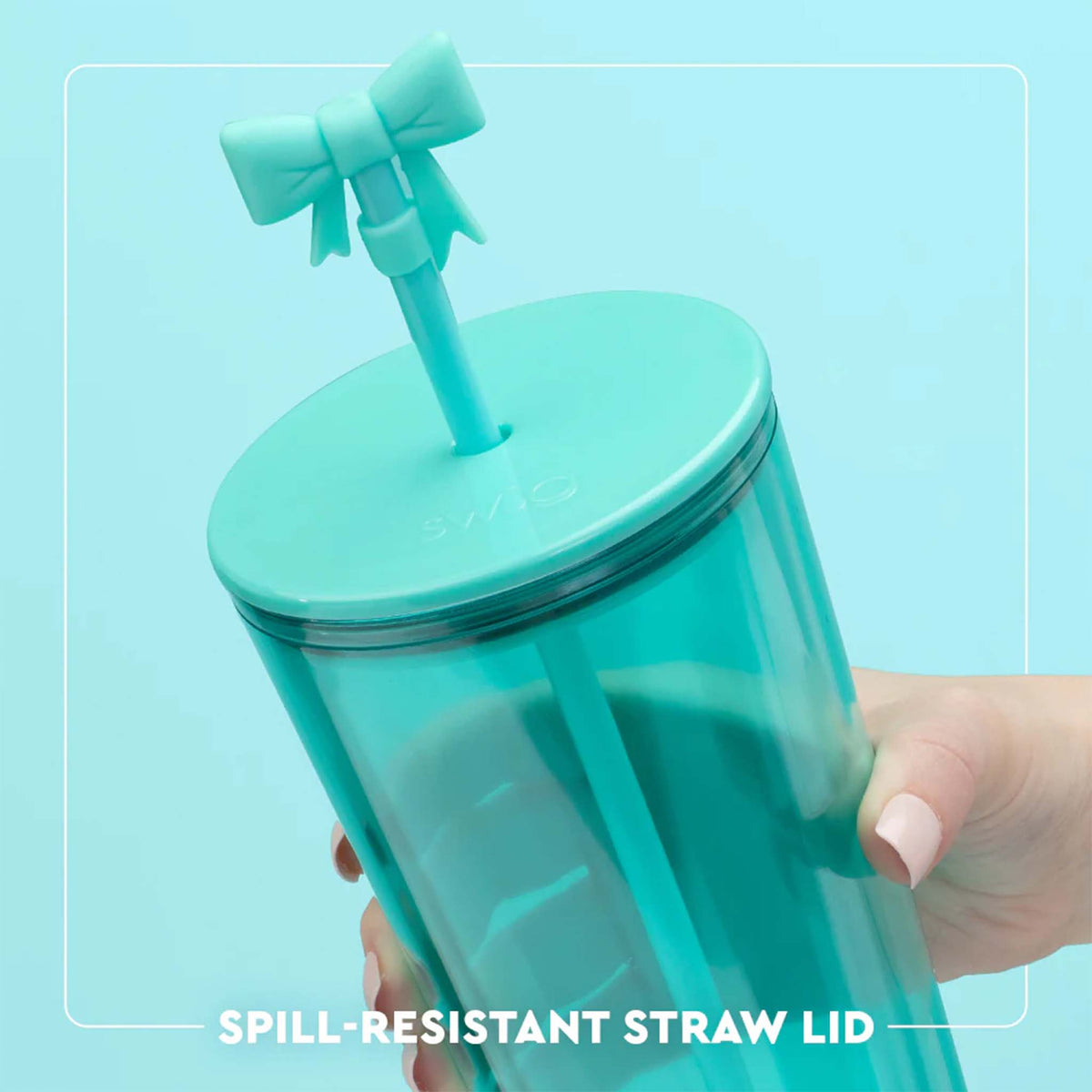Turquoise tumbler with a bow-shaped straw lid on a light blue background