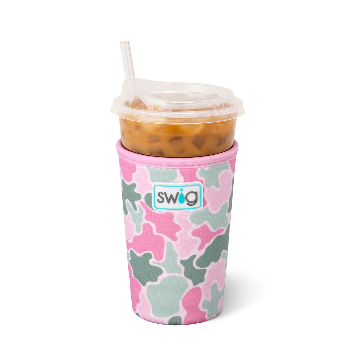 Swig Life Iced Cup Coolie in Blushing Camo print with pink, light green, and white abstract camo shapes, shown holding a clear plastic cup of iced coffee with straw.