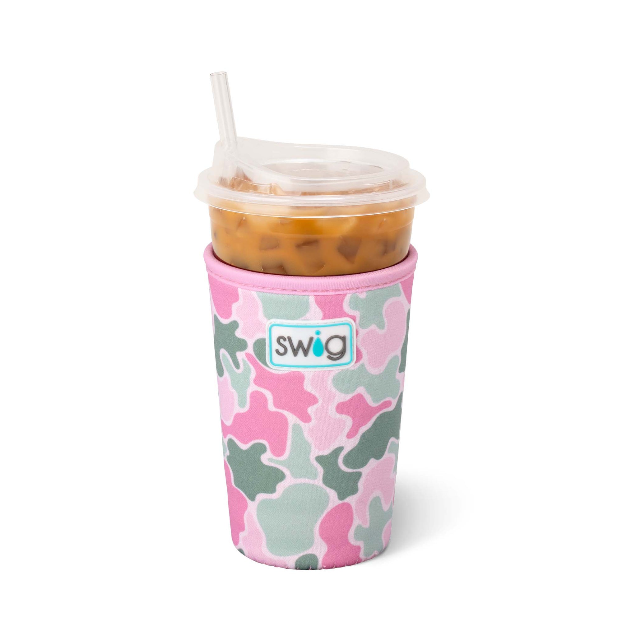 Swig Life Iced Cup Coolie in Blushing Camo print with pink, light green, and white abstract camo shapes, shown holding a clear plastic cup of iced coffee with straw.