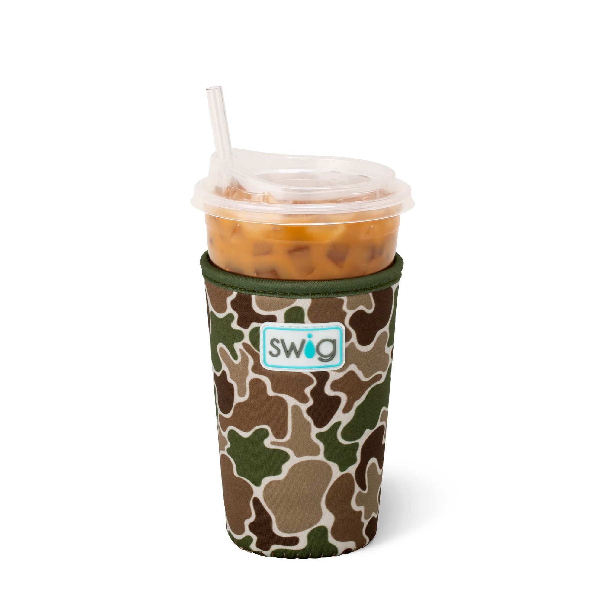 Swig Life Iced Cup Coolie in Hunting Camo print with green, brown, and tan abstract camo shapes, shown holding a clear plastic cup of iced coffee with straw.