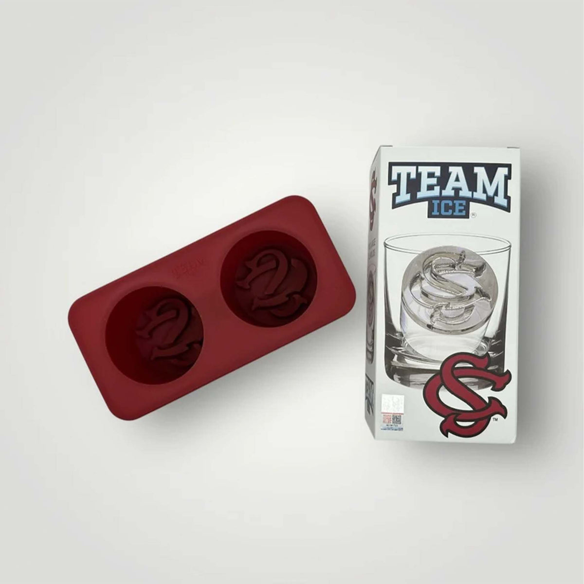 Red silicone ice mold tray with two South Carolina logo molds beside branded packaging labeled “Team Ice.”