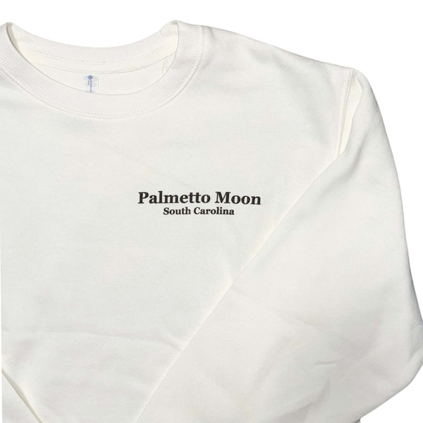  Ivory sweatshirt with 'Palmetto Moon South Carolina' text on a white background
