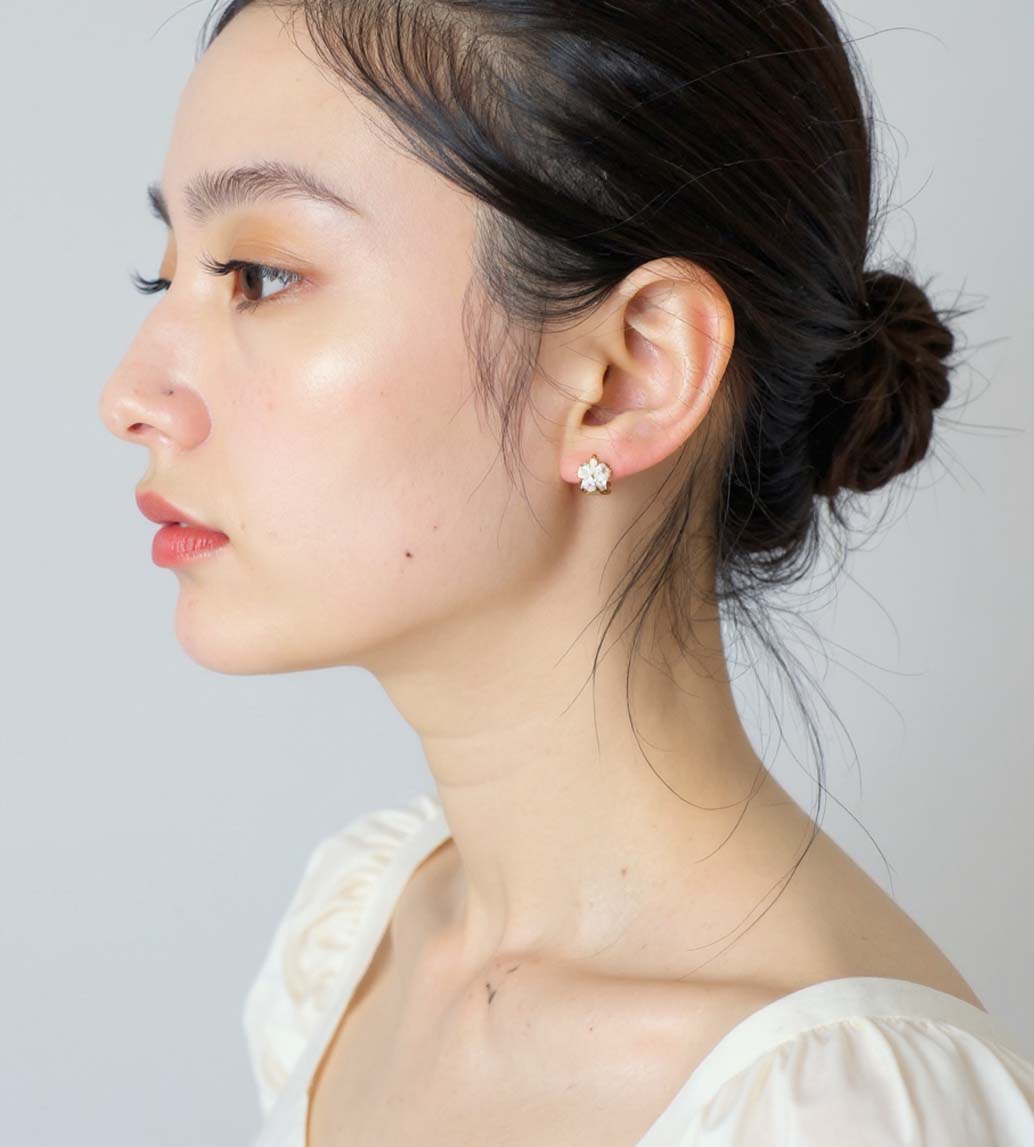 Gold and Diamond Flower Hoop Earrings shown on model