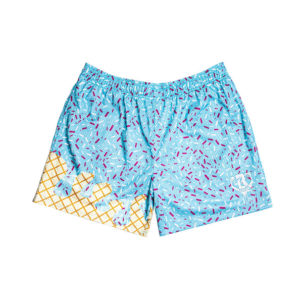 Front view of blue shorts with multicolor sprinkles and waffle cone melting print at the bottom, and a white logo on the leg.
