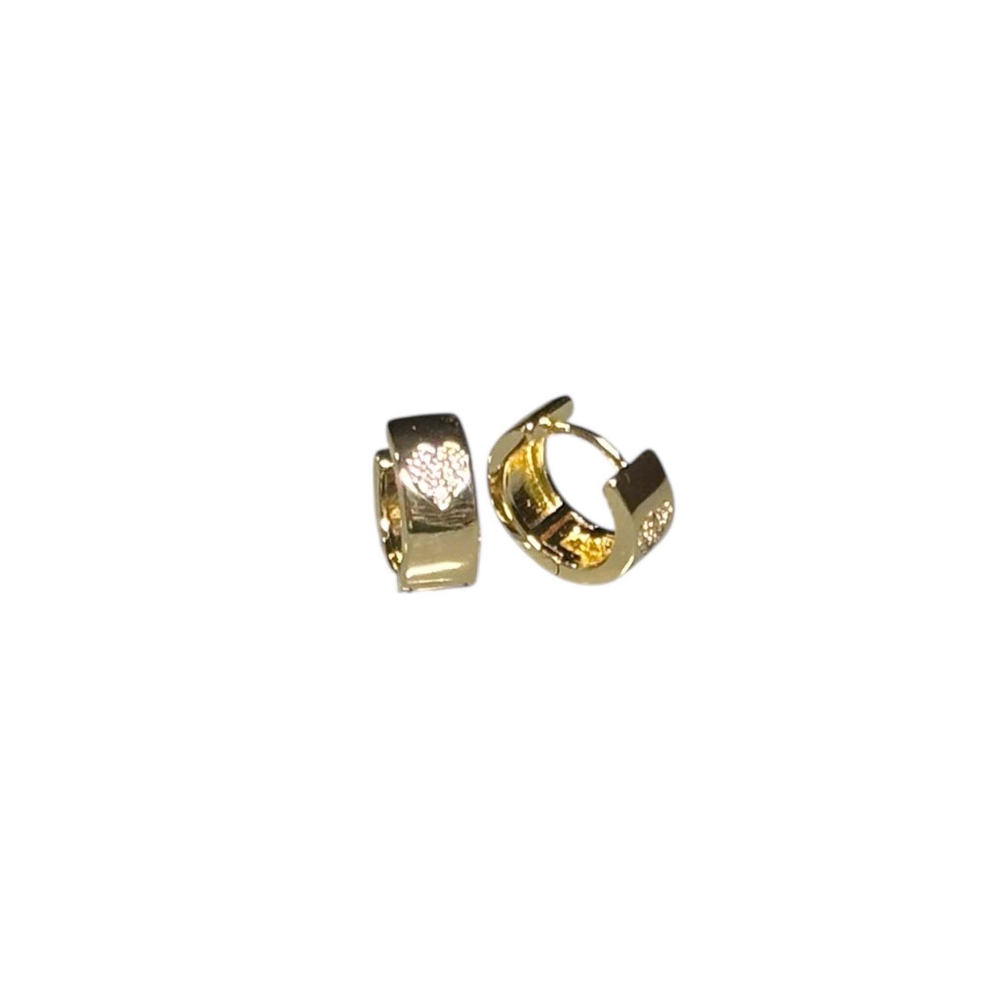 Gold-dipped huggie earrings with cubic zirconia heart design, shown angled on white background.