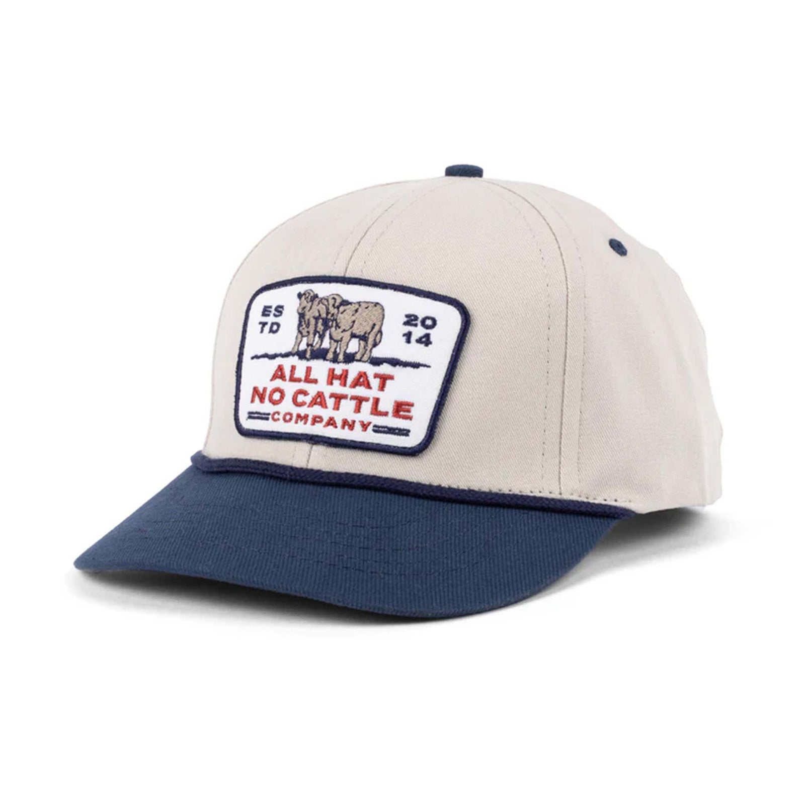 All Hat No Cattle Company cap with beige crown, navy brim, and embroidered patch of two cattle with text “All Hat No Cattle Company.”