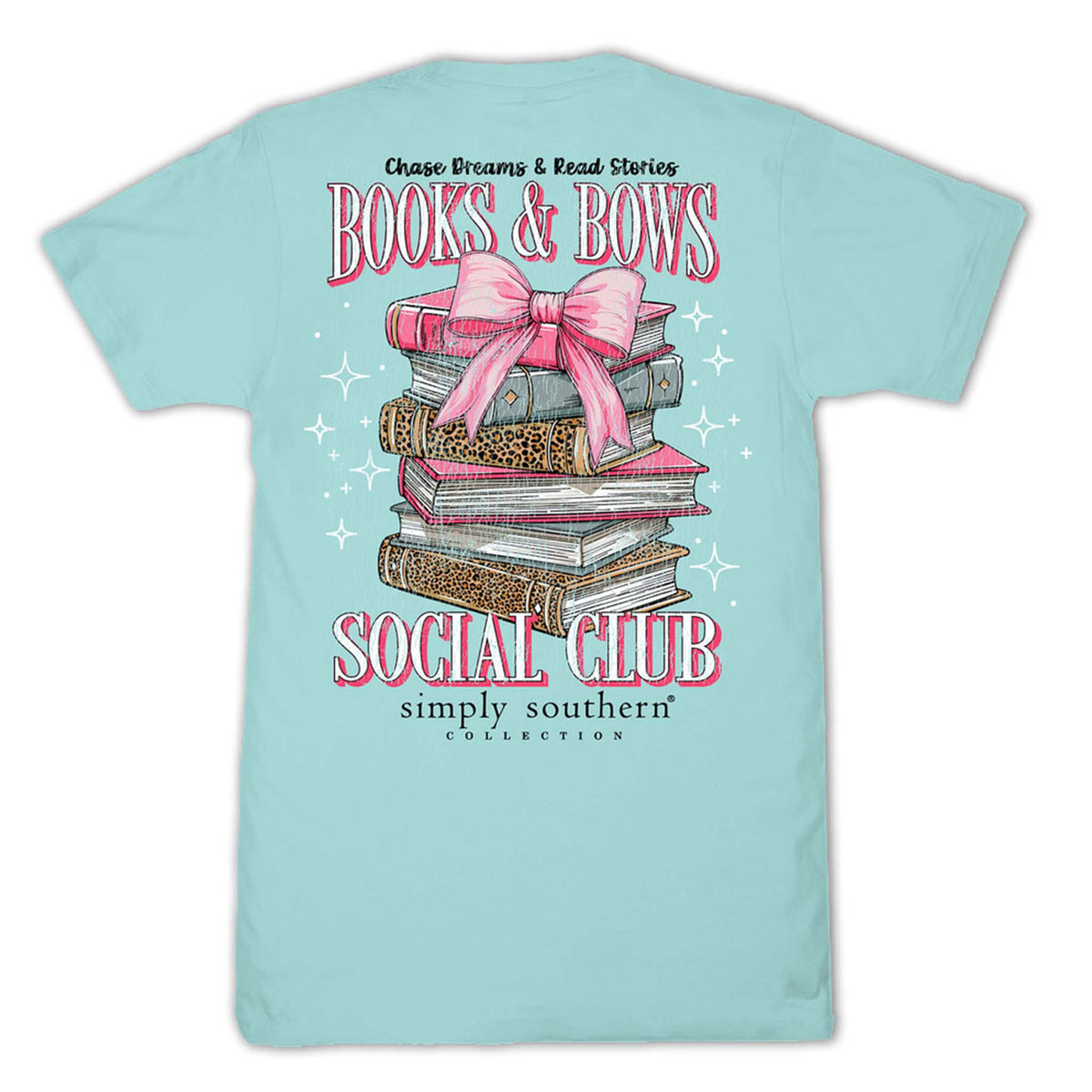 Light blue t-shirt with a graphic of books and a pink bow, text 'Books & Bows Social Club' on a white background.